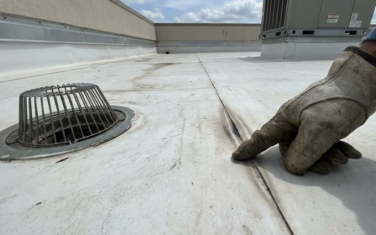 TPO roof seam, drain and HVAC curb during a commercial inspection