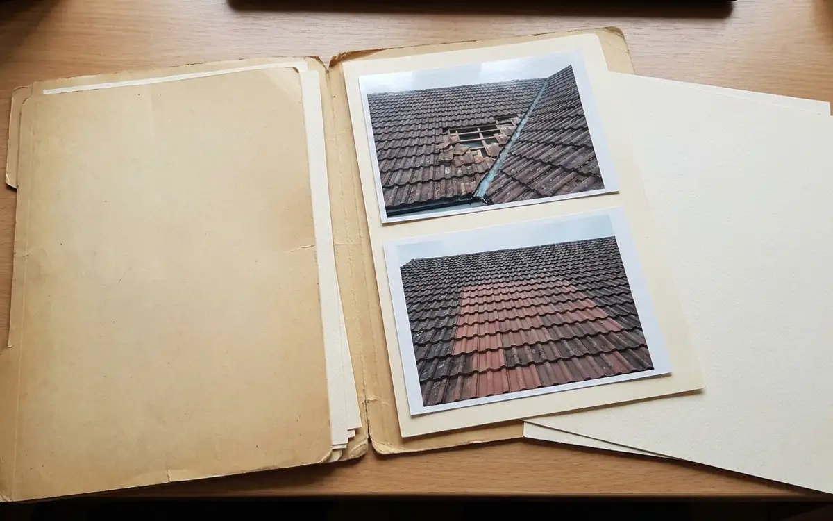 Blank repair documentation folder and roof photographs