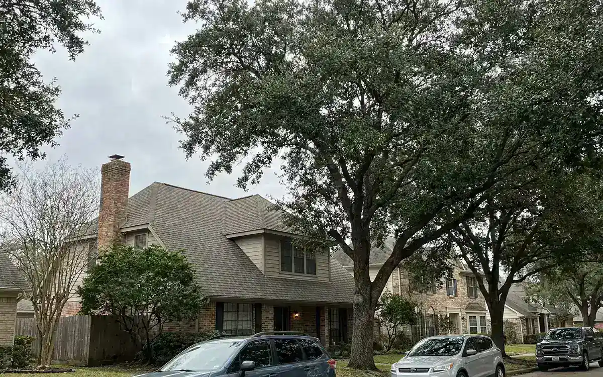 Houston-area residential roof in a mature neighborhood